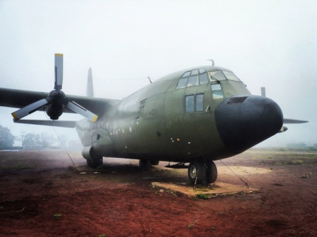 An abandoned Hercules Transport aircraft left sitting on the airstrip at Khe Sanh