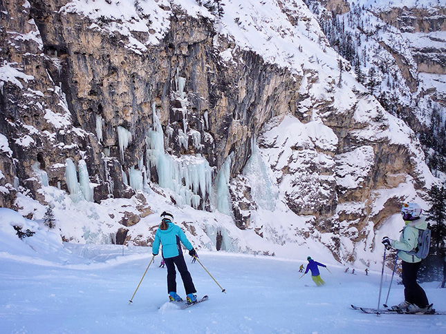 Skiing beneath one of the many frozen waterfalls along The Hidden Valley