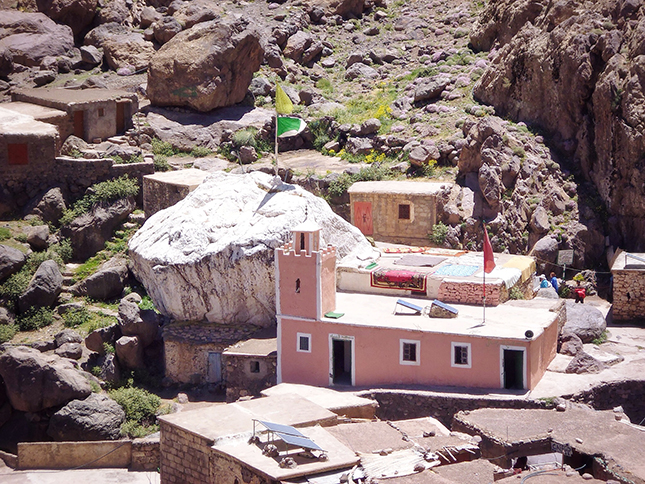 The shrine at Sidi Chamharouch and the white painted boulder