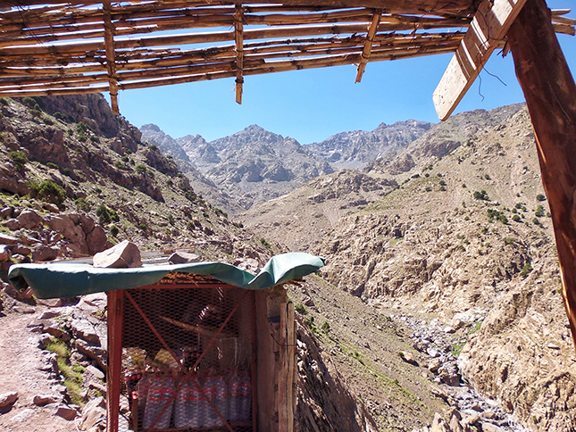 The high conical peaks loom in the background as we continue along the trail