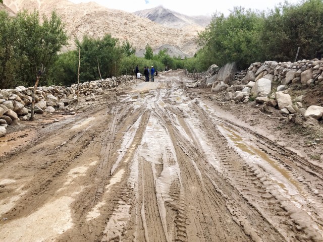 Muddy landslide across the valley road